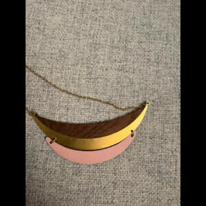 Pink, gold, and wood-designed necklace